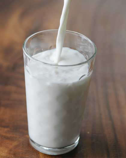 Our Products - Milk pouring in glass